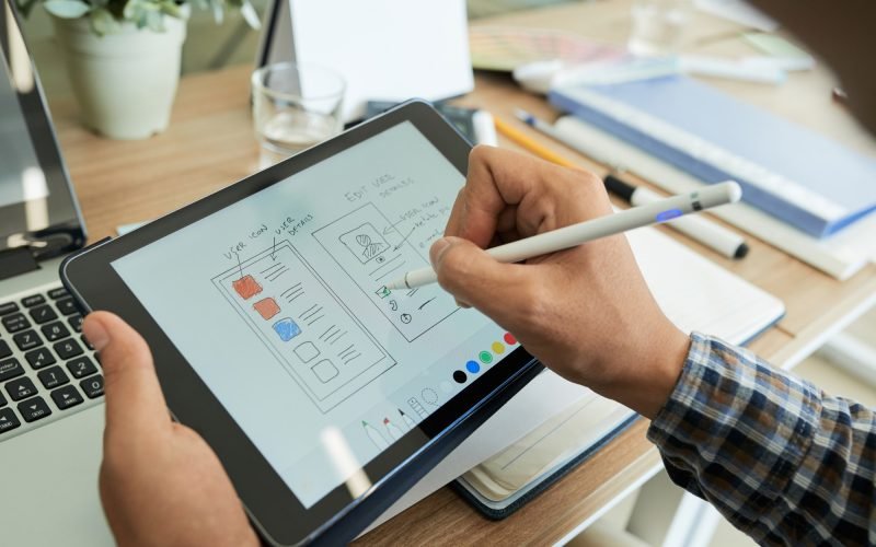 ui-designer-drawing-sketch-of-mobile-app.jpg ui-designer-drawing-sketch-of-mobile-app.jpg
